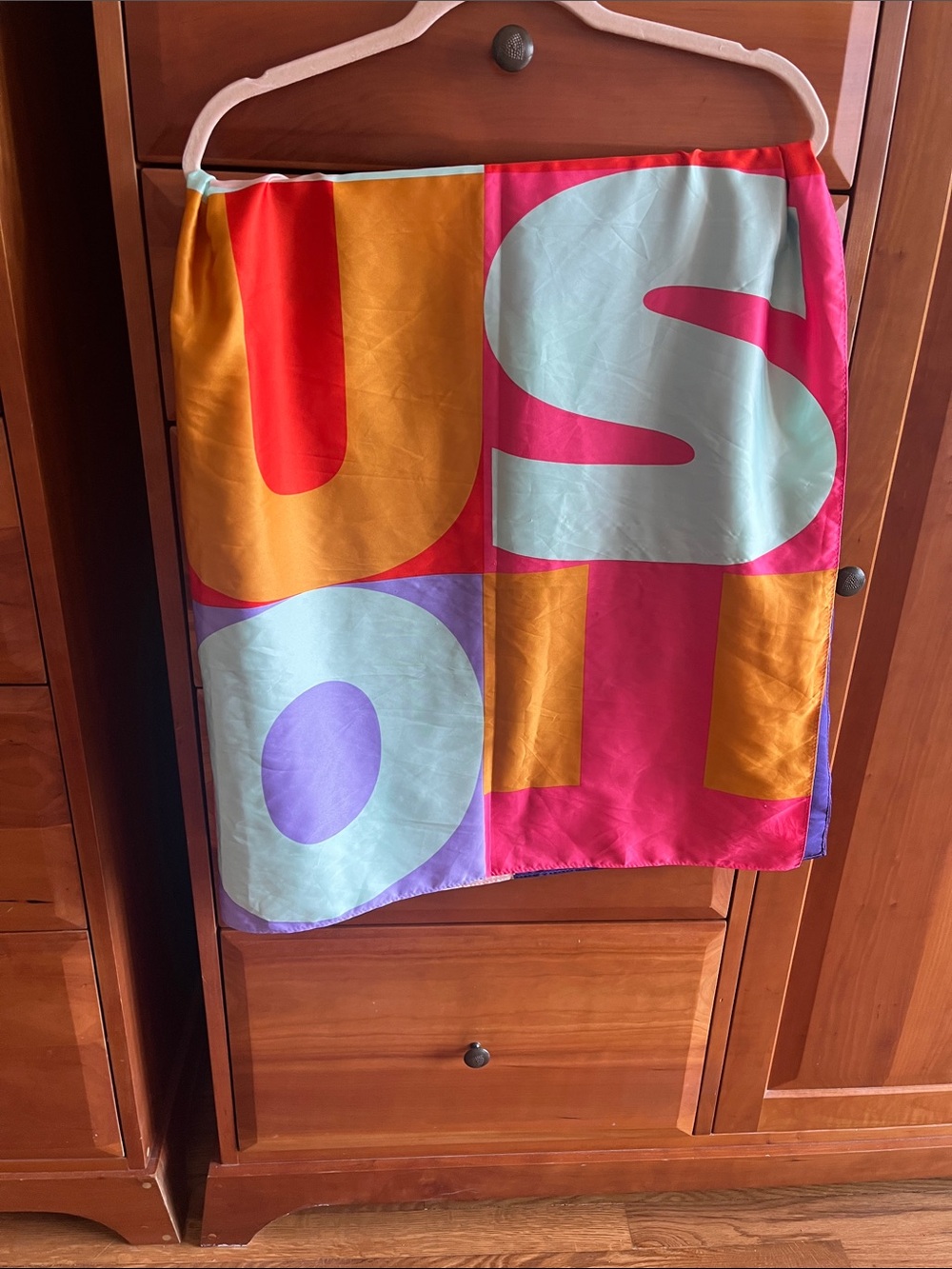 Tous Mimic Scarf In Bright, Vibrant Color Block Letters.